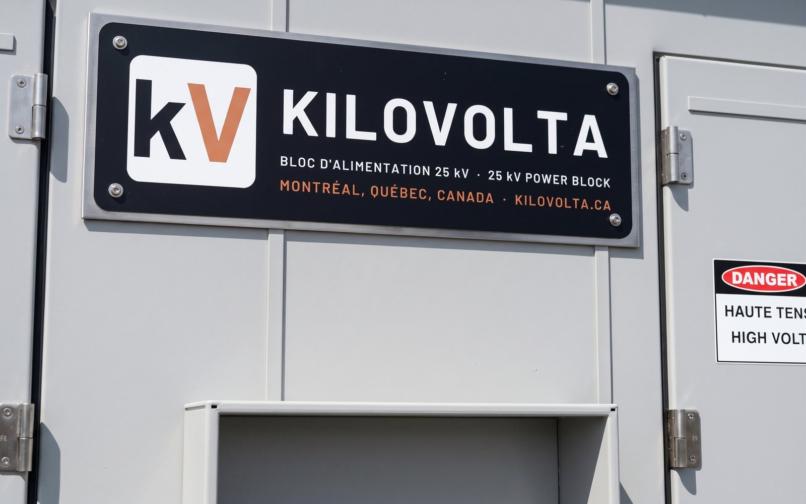 Kilovolta nameplate on the power house door